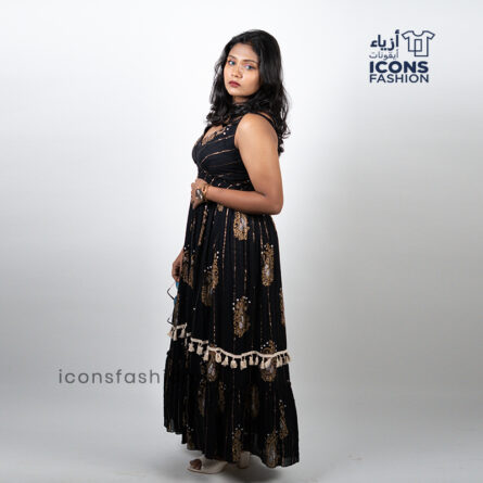 Black-sleeveless-maxi-dress-with-gold-paisley-prints-and-tassel-detailing-near-the-hem