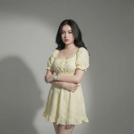 Women-yellow-eyelet-mini-dress-with-square-neck-puff-sleeves-smocked-waist-and-fit-and-flare-silhouette