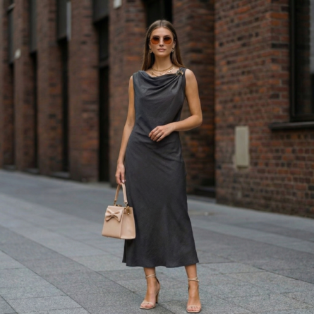 Woman-charcoal-grey-sleeveless-dress-with-draped-neckline