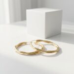 Women’s-gold-tone-twisted-hoop-earrings-with-layered-braided-design-and-polished-metallic-finish
