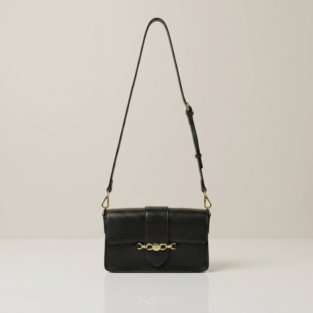 Black-structured-flap-shoulder-bag-with-gold-hardware-and-adjustable-crossbody-strap